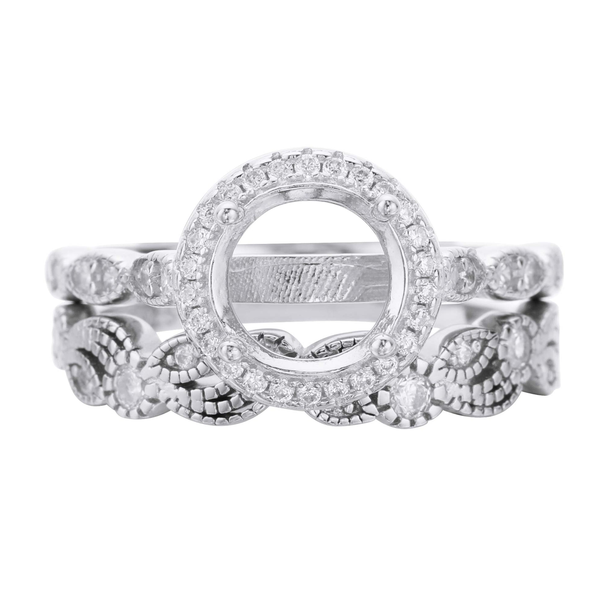 A silver art deco style halo semi mount with a filigree wave and gem studded design wedding band.