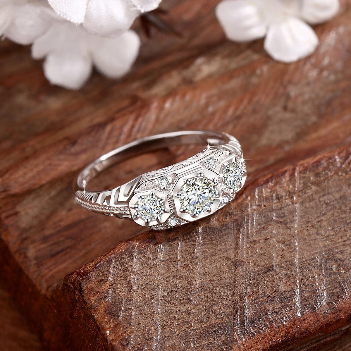 A silver Edwardian style vintage filigree 3 stone ring.