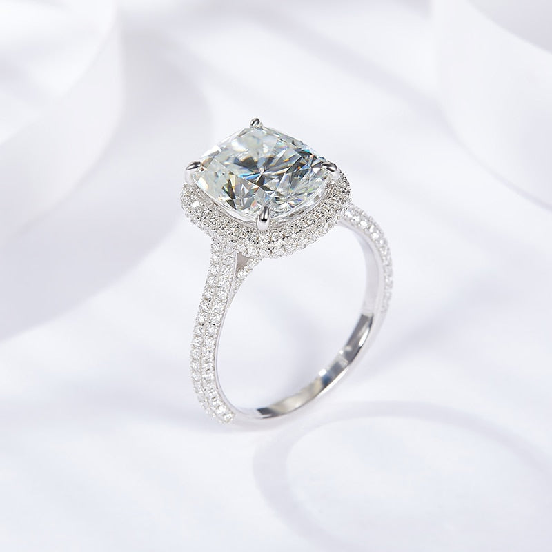 A silver 5CT radiant cut cathedral set gem encrusted halo ring.