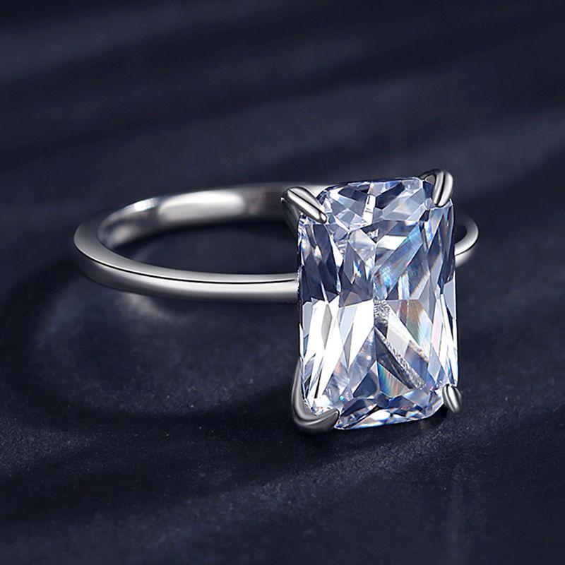 A silver large radiant cut solitaire engagement ring.