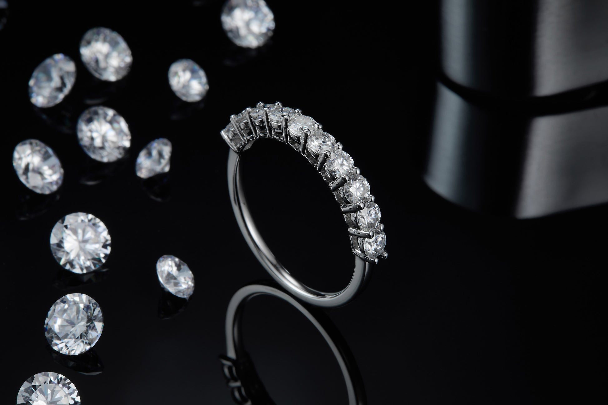 A round cut wedding ring with several small round gems.