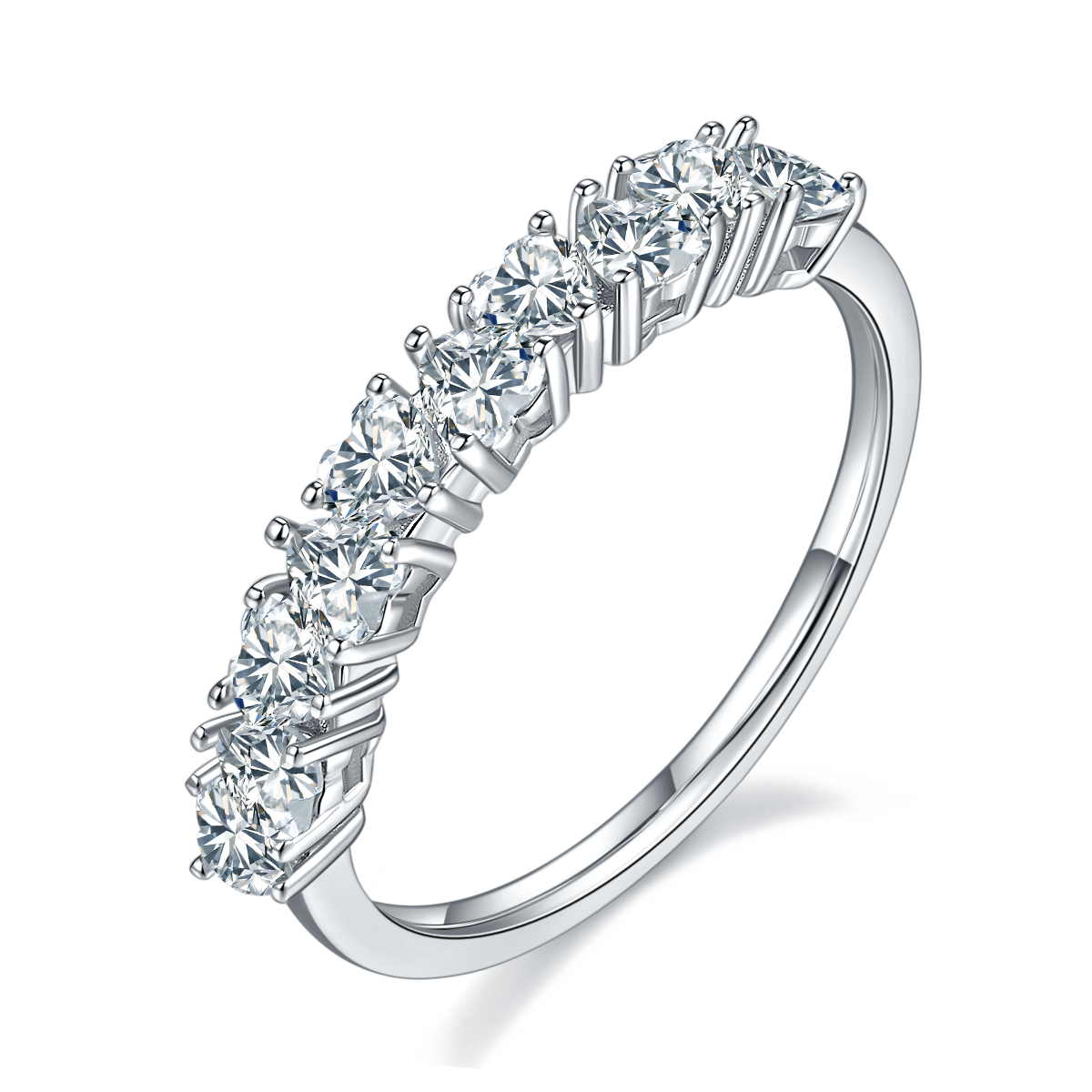 A silver half eternity wedding ring set with several heart cut moissanites set in alternating directions.