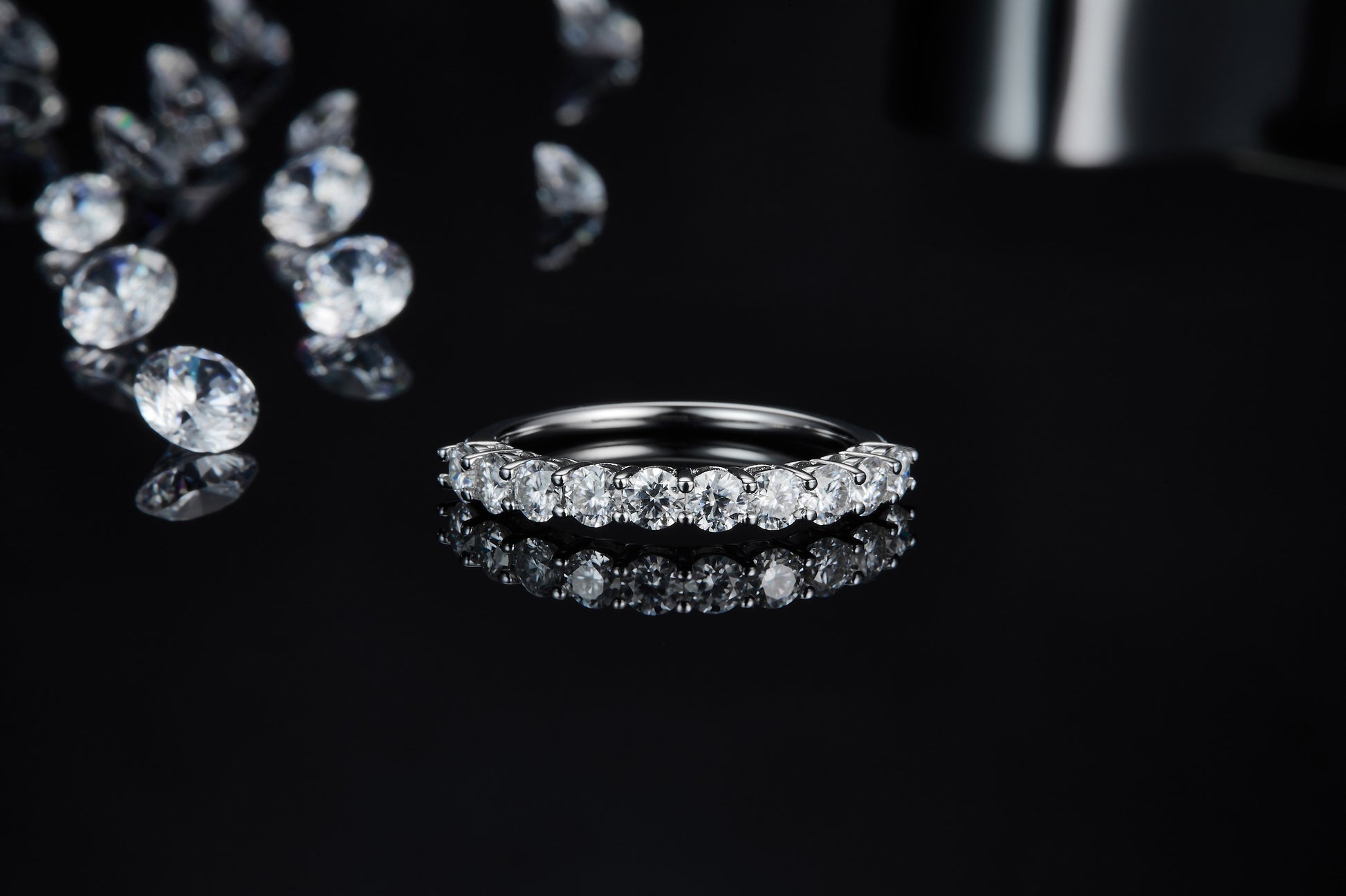 A round cut wedding ring with several small round gems.
