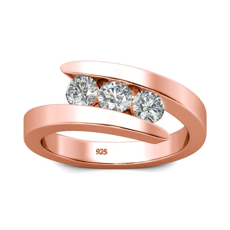 A rose gold 3 stone bypass ring tension set with three 0.3CT moissanites floating.