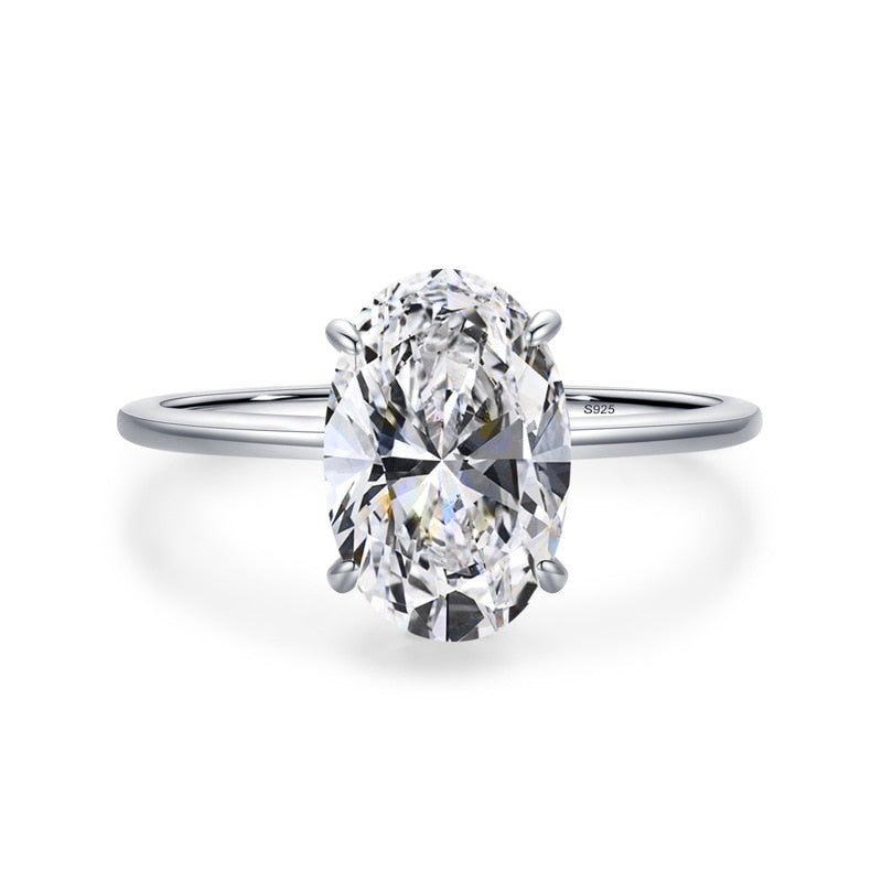 A silver solitaire ring set with a large oval moissanite.
