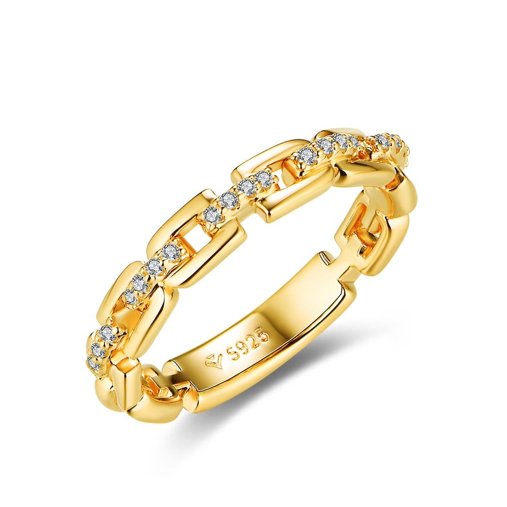 A gold D link ring with moissanite studded connectors.