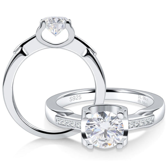 Two silver tension set engagement rings with tapered shanks.