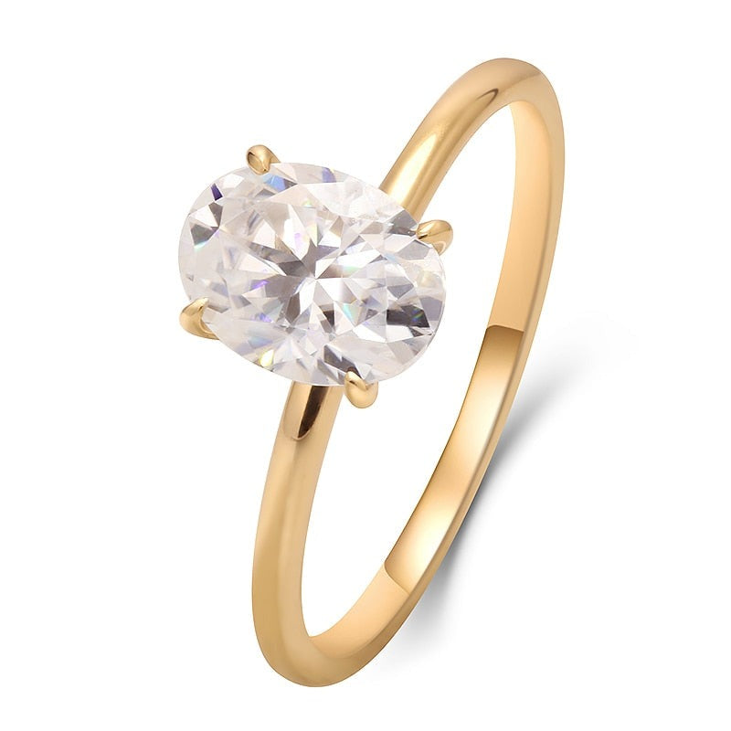 Solid yellow gold oval cut moissanite engagement ring.