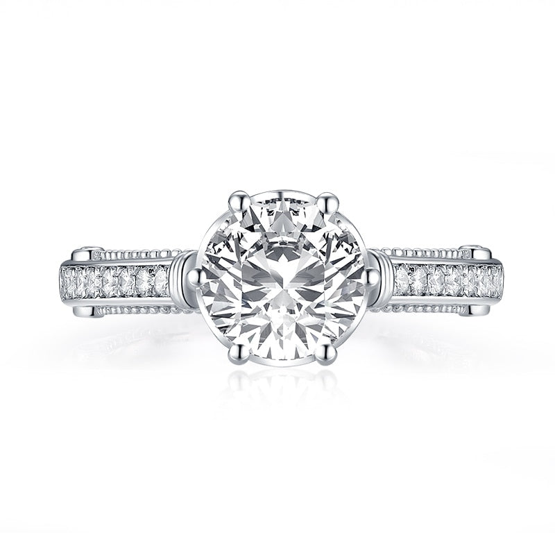 Silver filigree engagement ring with a round cut moissanite.