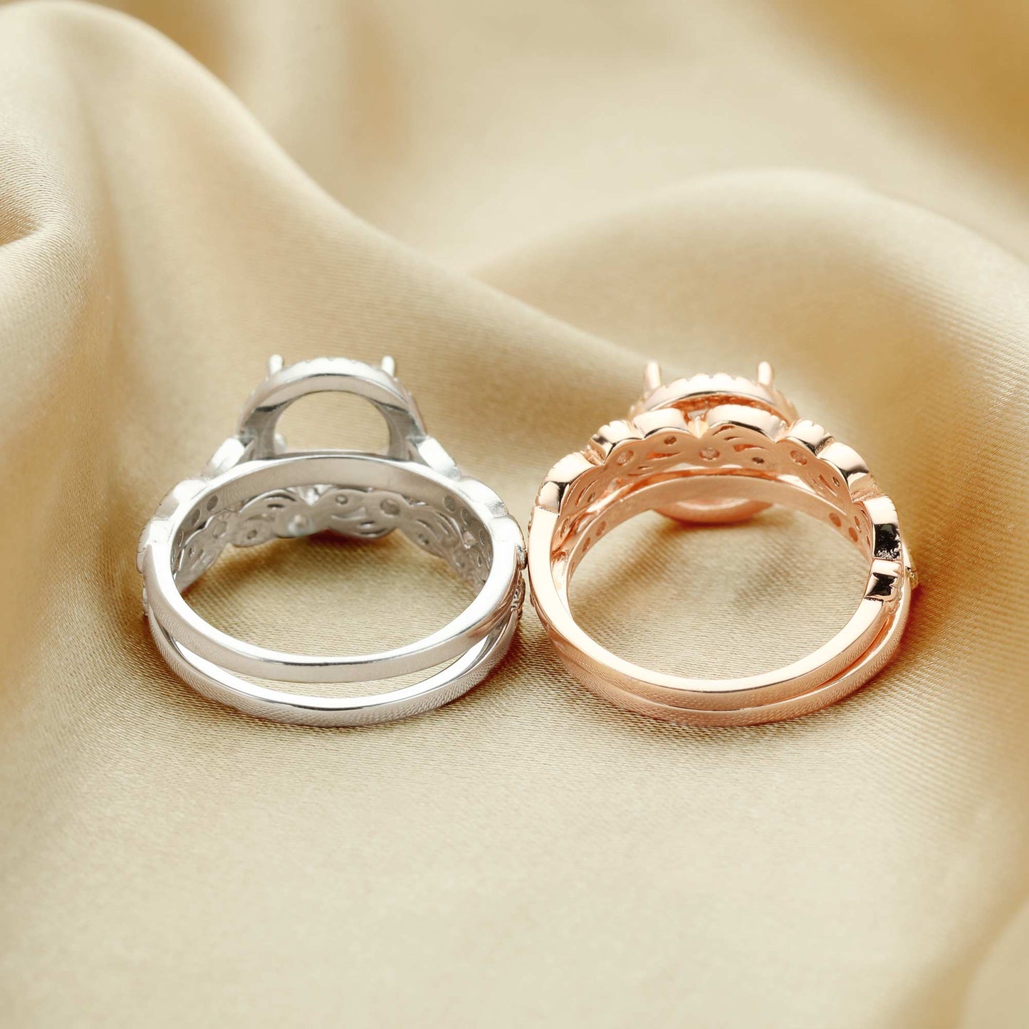 One silver and one rose gold art deco style halo semi mount with a filigree wave and gem studded design wedding bands.
