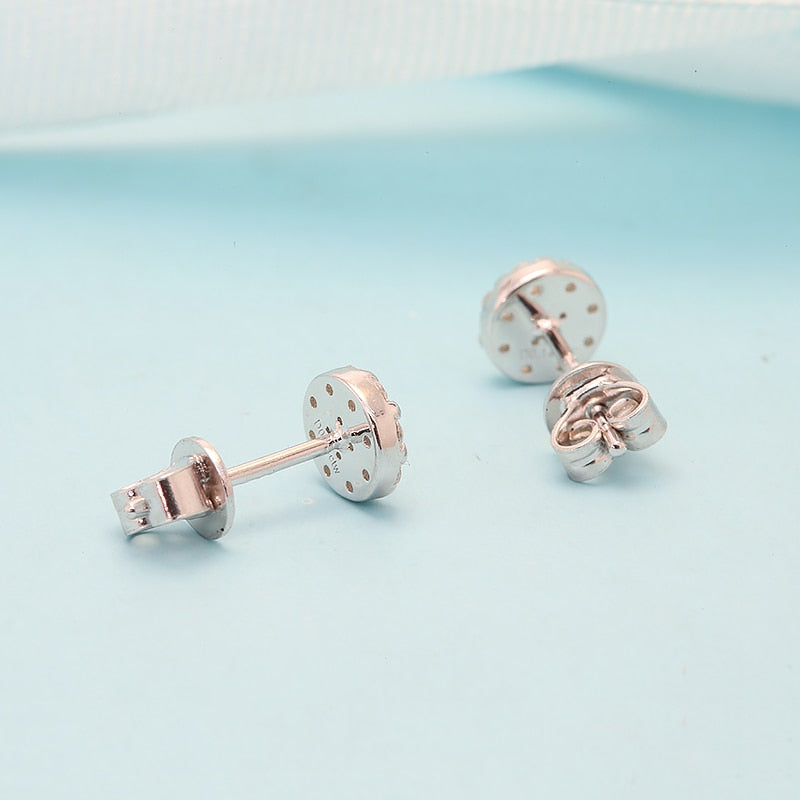Round Iced out silver moissanite earring studs.