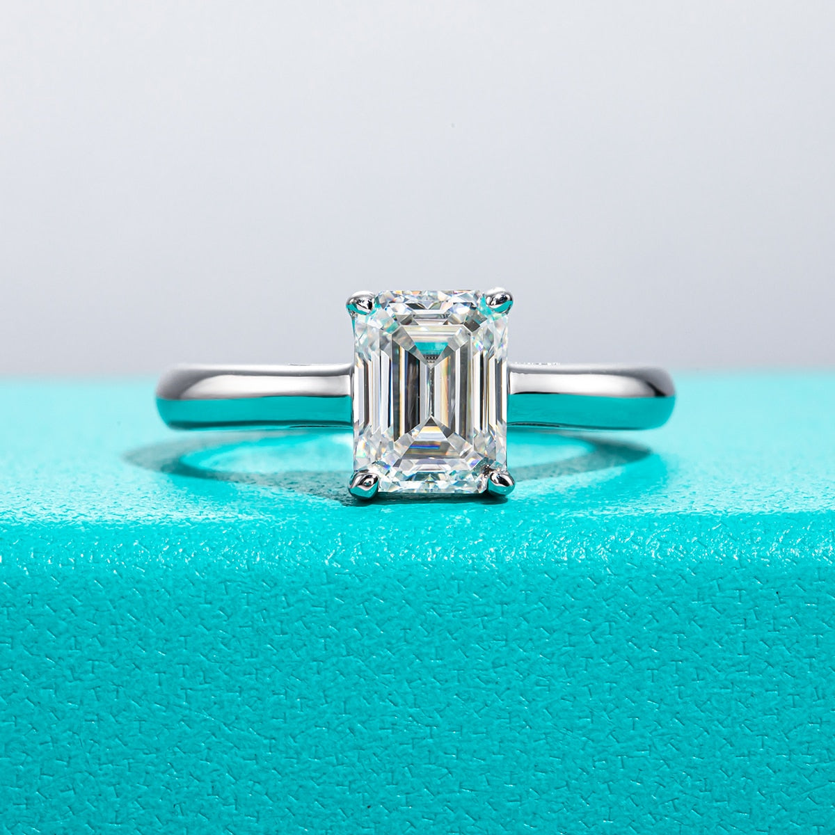 A 2CT emerald cut moissanite sterling silver ring.