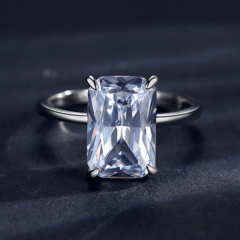A silver large radiant cut solitaire engagement ring.