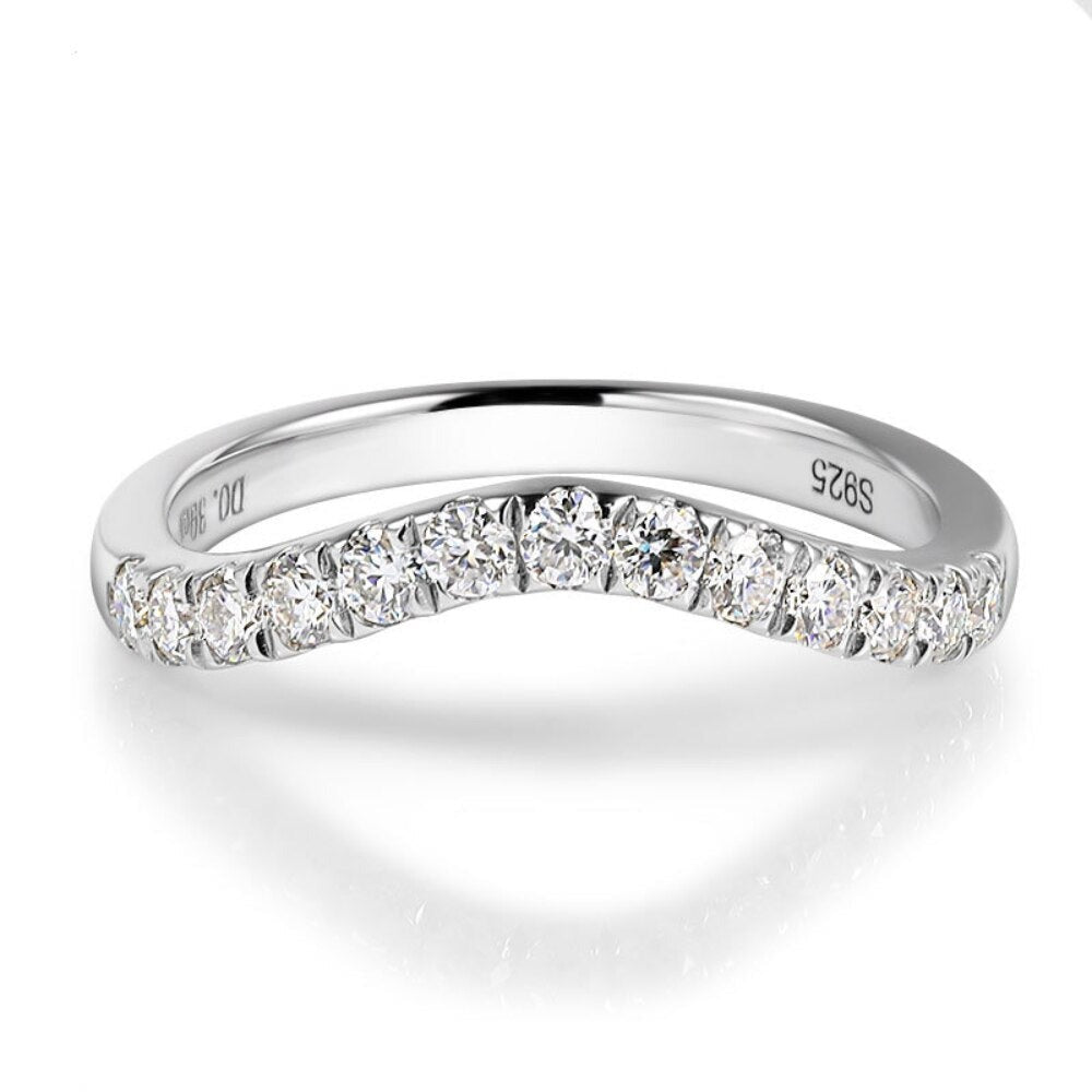 A silver curved wedding ring with 13 clear gems.